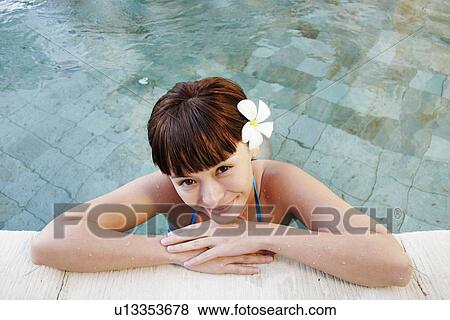 Portrait of a teenage girl leaning by swimming pool. View Large Photo Image Stock Photo - Portrait of a teenage girl leaning by swimming pool.. Fotosearch