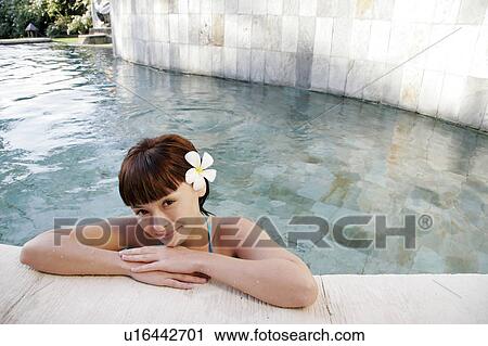 Portrait of a teenage girl leaning near swimming pool. View Large Photo Image Stock Image - Portrait of a teenage girl leaning near swimming pool.. Fotosearch