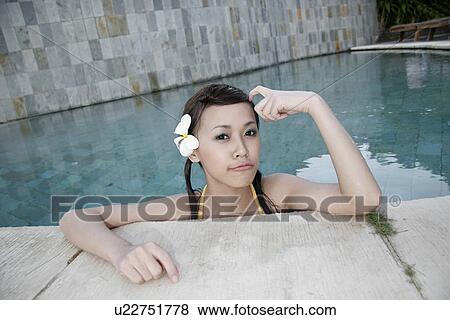 Portrait of a teenage girl leaning near swimming pool. View Large Photo Image Stock Photo - Portrait of a teenage girl leaning near swimming pool.. Fotosearch