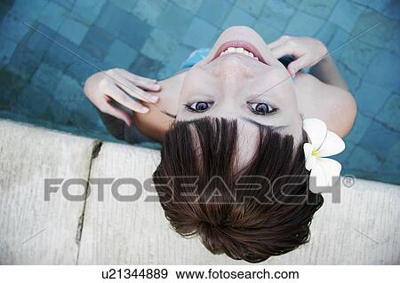 Portrait of a teenage girl standing in swimming pool. View Large Photo Image Stock Photo - Portrait of a teenage girl standing in swimming pool.. Fotosearch