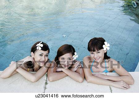 Portrait of three teenage girls in swimming pool. View Large Photo Image Stock Photograph - Portrait of three teenage girls in swimming pool.. Fotosearch