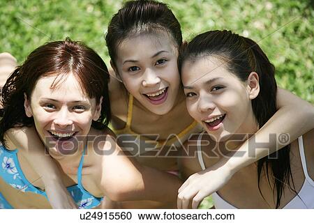 Portrait of three teenage girls with arms around each other. View Large Photo Image Stock Image - Portrait of three teenage girls with arms around each other.. Fotosearch