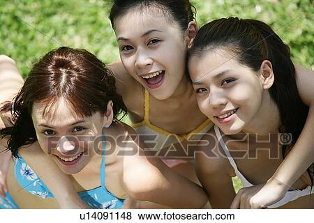 Portrait of three teenage girls with arms around, in bras. View Large Photo Image Stock Photo - Portrait of three teenage girls with arms around, in bras.. Fotosearch