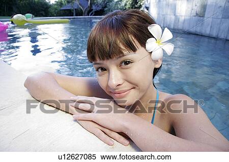 View of a teenage girl in a swimming pool. View Large Photo Image Stock Photography - View of a teenage girl in a swimming pool.. Fotosearch