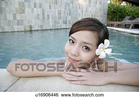 View of a teenage girl leaning by swimming pool. View Large Photo Image Stock Photograph - View of a teenage girl leaning by swimming pool.. Fotosearch