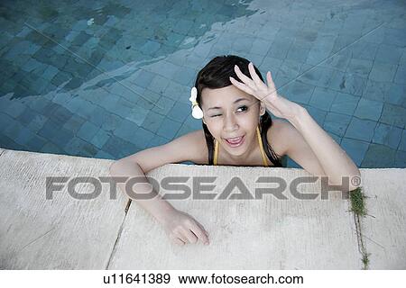 View of a teenage girl winking. View Large Photo Image Stock Photo - View of a teenage girl winking.. Fotosearch