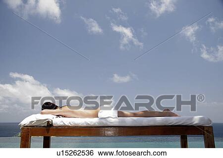 View of a female sun bathing. View Large Photo Image Stock Photograph - View of a female sun bathing.. Fotosearch