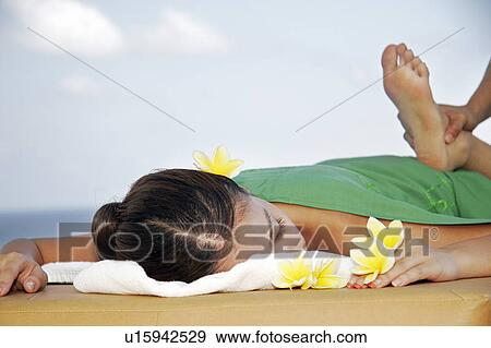 View of a teenage girl having a massage. View Large Photo Image Stock Photo - View of a teenage girl having a massage.. Fotosearch