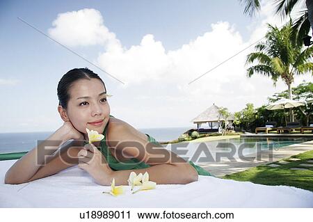 View of a teenage girl leaning on a table. View Large Photo Image Stock Image - View of a teenage girl leaning on a table.. Fotosearch