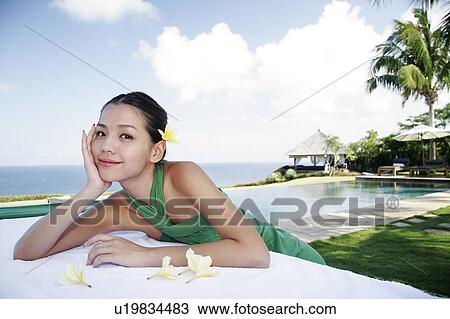 View of a teenage girl leaning on a table. View Large Photo Image Stock Image - View of a teenage girl leaning on a table.. Fotosearch