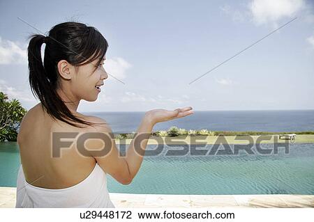 View of a teenage girl near the sea. View Large Photo Image Stock Image - View of a teenage girl near the sea.. Fotosearch
