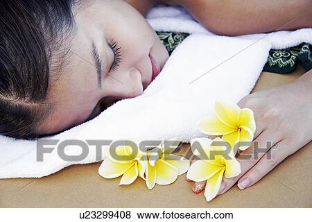 Stock Photo - View of a teenage girl relaxing.. Fotosearch