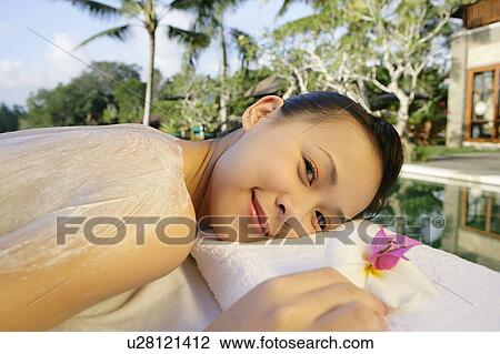 Stock Image - View of a teenage girl smiling.. Fotosearch