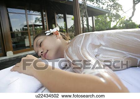 View of a teenage girl with cream on her back. View Large Photo Image Stock Image - View of a teenage girl with cream on her back.. Fotosearch