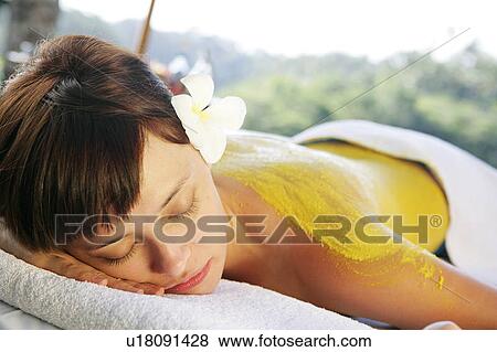 View of a teenage girl with cream applied on her back. View Large Photo Image Stock Photo - View of a teenage girl with cream applied on her back.. Fotosearch