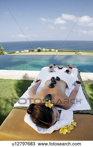 High angle view of a teenage girl lying on massage table. View Large Photo Image Stock Image - High angle view of a teenage girl lying on massage table.. Fotosearch