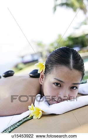 Portrait of a teenage girl lying on a massage table. View Large Photo Image Stock Image - Portrait of a teenage girl lying on a massage table.. Fotosearch