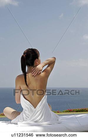 Rear view of a teenage girl against the sea. View Large Photo Image Stock Photograph - Rear view of a teenage girl against the sea.. Fotosearch