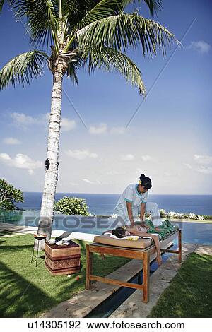 View of a masseuse massaging a female. View Large Photo Image Stock Image - View of a masseuse massaging a female.. Fotosearch