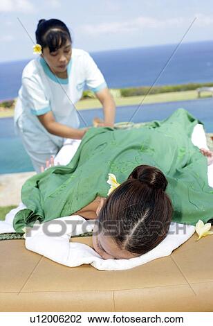 View of a masseuse massaging a teenage girl. View Large Photo Image Stock Image - View of a masseuse massaging a teenage girl.. Fotosearch