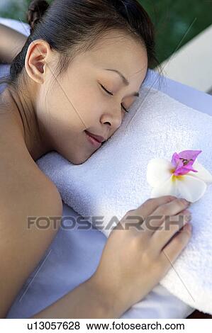 View of a teenage girl relaxing on a bed. View Large Photo Image Stock Photo - View of a teenage girl relaxing on a bed.. Fotosearch