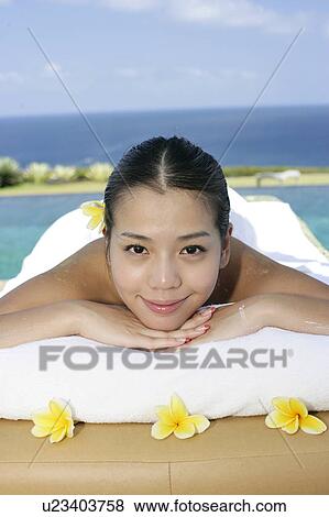 View of a teenage girl relaxing on a bed. View Large Photo Image Stock Photo - View of a teenage girl relaxing on a bed.. Fotosearch