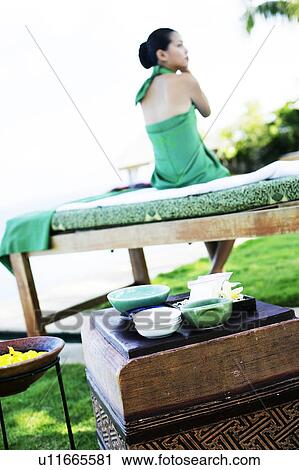 View of a teenage girl sitting on the bed. View Large Photo Image Stock Image - View of a teenage girl sitting on the bed.. Fotosearch