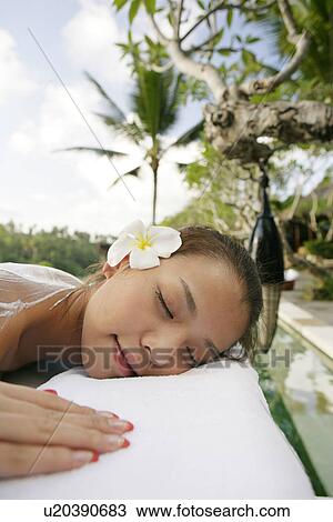 View of a teenage girl sleeping on a massage table. View Large Photo Image Stock Image - View of a teenage girl sleeping on a massage table.. Fotosearch