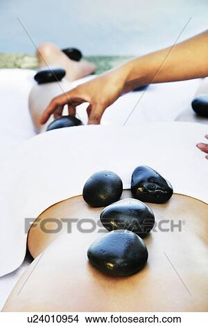 View of stones on a female’s body. View Large Photo Image Picture - View of stones on a female’s body.. Fotosearch
