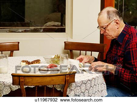 An elderly man at the breakfast table. View Large Photo Image Stock Image - An elderly man at the breakfast table.. Fotosearch