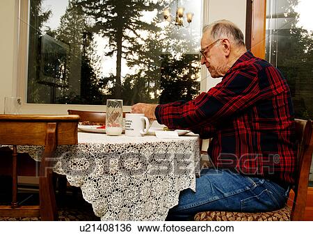 An elderly man seated at the breakfast table. View Large Photo Image Stock Photograph - An elderly man seated at the breakfast table.. Fotosearch