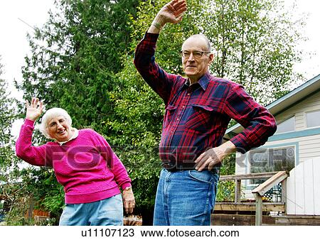 An old couple exercising together. View Large Photo Image Stock Image - An old couple exercising together.. Fotosearch
