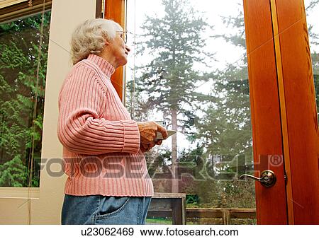 An old woman admiring the nature. View Large Photo Image Stock Photo - An old woman admiring the nature.. Fotosearch