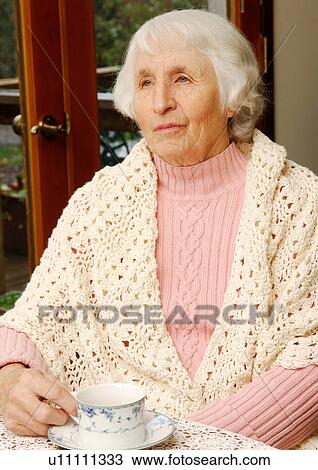 Close-up of a elderly woman absorbed in her thoughts. View Large Photo Image Stock Image - Close-up of a elderly woman absorbed in her thoughts.. Fotosearch