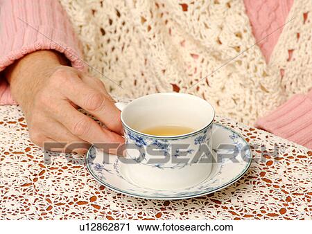 Close-up of tea served in a cup. View Large Photo Image Stock Image - Close-up of tea served in a cup.. Fotosearch