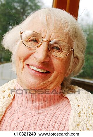 Portrait of a cheerful elderly woman. View Large Photo Image Stock Photo - Portrait of a cheerful elderly woman.. Fotosearch