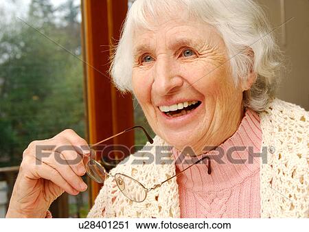 Portrait of a jovial elderly woman. View Large Photo Image Stock Image - Portrait of a jovial elderly woman.. Fotosearch