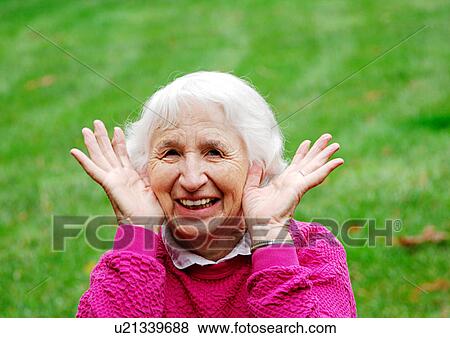 Portrait of a woman gesturing childishly. View Large Photo Image Stock Photo - Portrait of a woman gesturing childishly.. Fotosearch