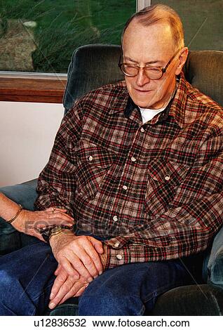 Portrait of an elderly man resting on a chair. View Large Photo Image Stock Image - Portrait of an elderly man resting on a chair.. Fotosearch