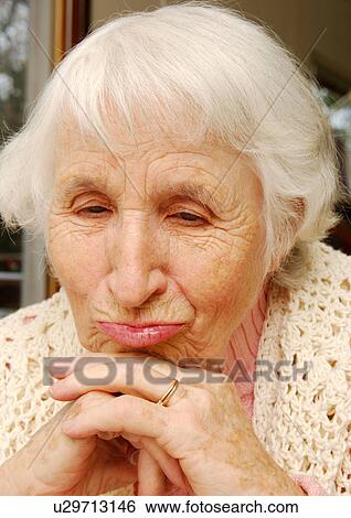 Stock Photograph - Portrait of an elderly woman pouting.. Fotosearch