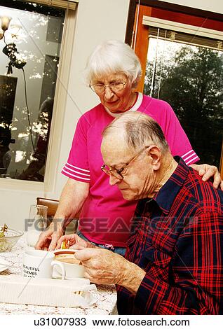 View of an elderly couple at the breakfast table. View Large Photo Image Stock Image - View of an elderly couple at the breakfast table.. Fotosearch