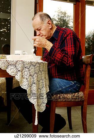 View of an elderly man at the breakfast table. View Large Photo Image Stock Photo - View of an elderly man at the breakfast table.. Fotosearch
