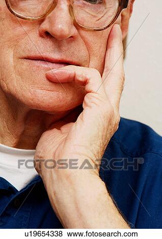 Portrait of an elderly man in a pensive mood. View Large Photo Image Stock Photo - Portrait of an elderly man in a pensive mood.. Fotosearch