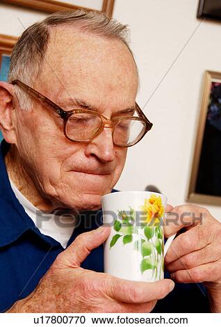 Portrait of an elderly man sipping a cup of tea. View Large Photo Image Stock Image - Portrait of an elderly man sipping a cup of tea.. Fotosearch