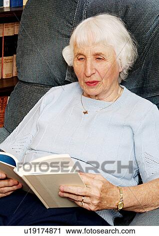 Portrait of an elderly woman reading a book. View Large Photo Image Stock Image - Portrait of an elderly woman reading a book.. Fotosearch