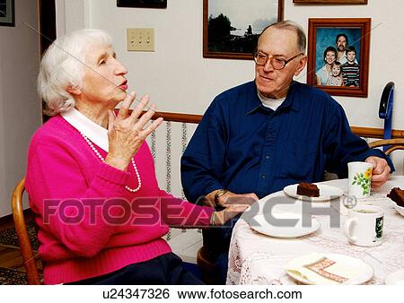 View of an elderly couple at the breakfast table. View Large Photo Image Stock Photograph - View of an elderly couple at the breakfast table.. Fotosearch