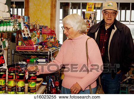 View of an elderly couple shopping in a supermarket. View Large Photo Image Stock Photography - View of an elderly couple shopping in a supermarket.. Fotosearch