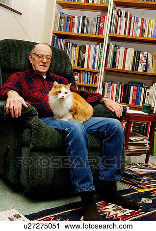 View of an elderly man with his pet cat. View Large Photo Image Stock Image - View of an elderly man with his pet cat.. Fotosearch