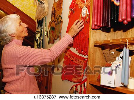 View of an elderly woman shopping in a supermarket. View Large Photo Image Stock Photo - View of an elderly woman shopping in a supermarket.. Fotosearch