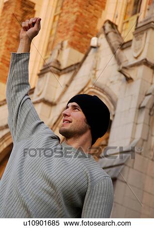 Stock Photography - Portrait of a cheerful young man.. Fotosearch